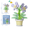 A set of creative flower pot building blocks showing a purple flower plant with green leaves and a yellow flower.