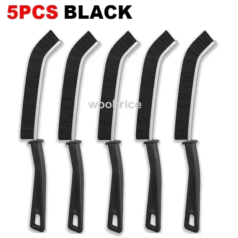 A set of five black multifunctional crevice cleaning brushes.