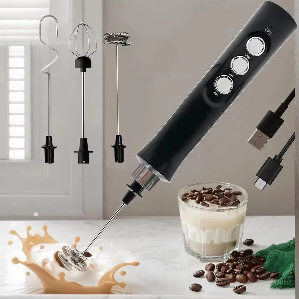 A black rechargeable electric milk frother and whisk is shown with coffee beans on a white marble surface.