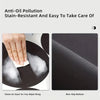 Close-up of a black silicone mat showing stain resistance and a non-slip bottom texture.