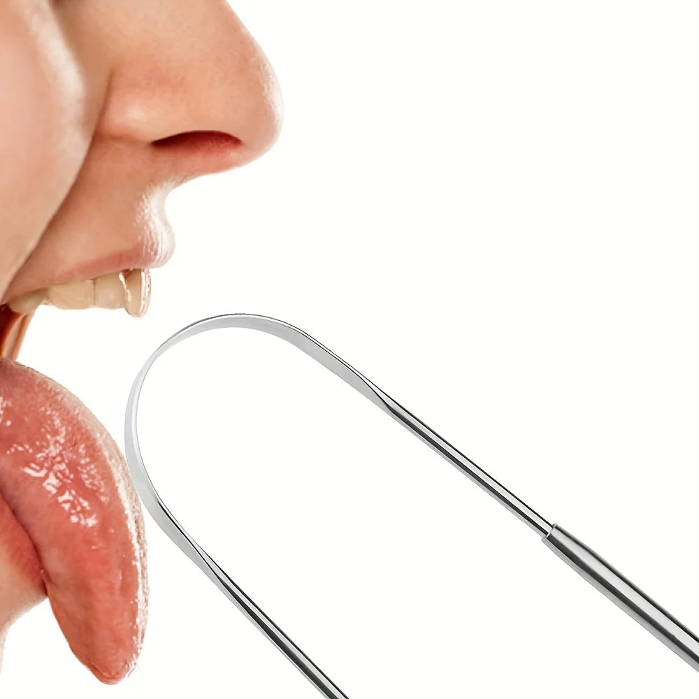 A stainless steel tongue scraper is shown next to a person's mouth, used for cleaning the tongue.