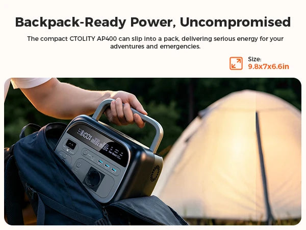 A hand places a compact portable power station into a backpack next to a tent.