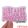 Pink embroidered iron-on patches featuring the text I CRY A LOT BUT I AM SO PRODUCTIVE and IT'S AN ART