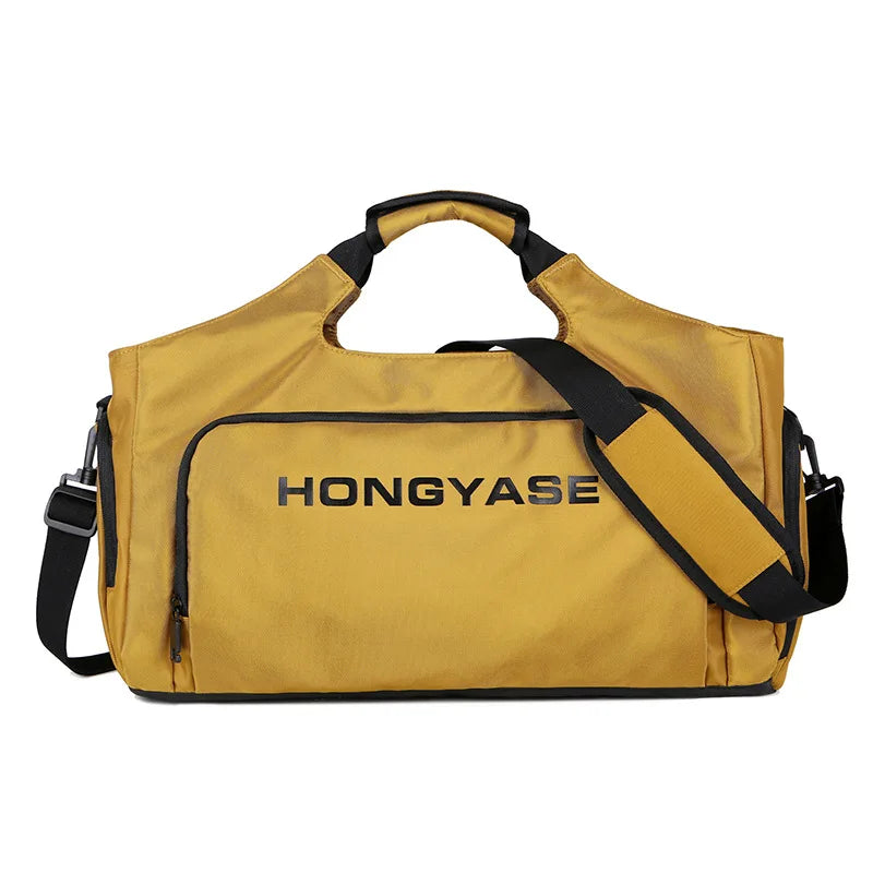 A mustard yellow duffel bag with black straps and a shoe pocket visible from the front.