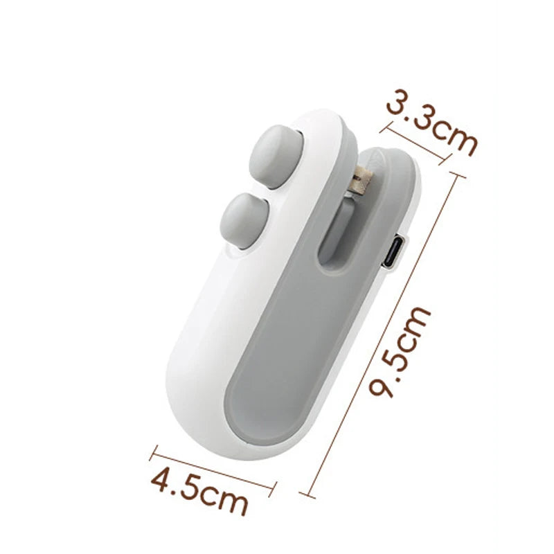 A white portable 2-in-1 bag sealer and cutter device shown from the side with dimensions marked.