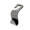 A black car headrest hook with a curved design, covered in clear rhinestones.
