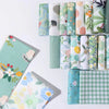 A collection of 40 floral cotton fabric strips in various patterns and colors for quilting and patchwork.