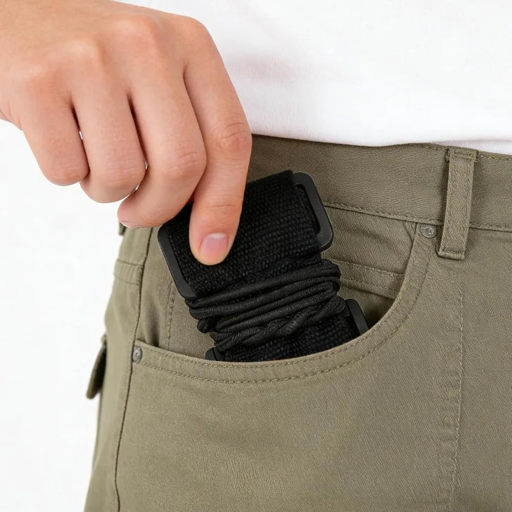 A hand is inserting black adjustable luggage connector straps into a pocket of olive green fabric.