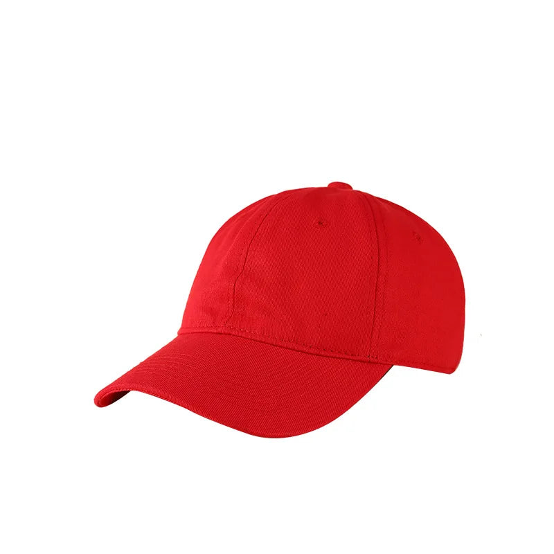 A solid red classic cotton dad hat shown from the side.