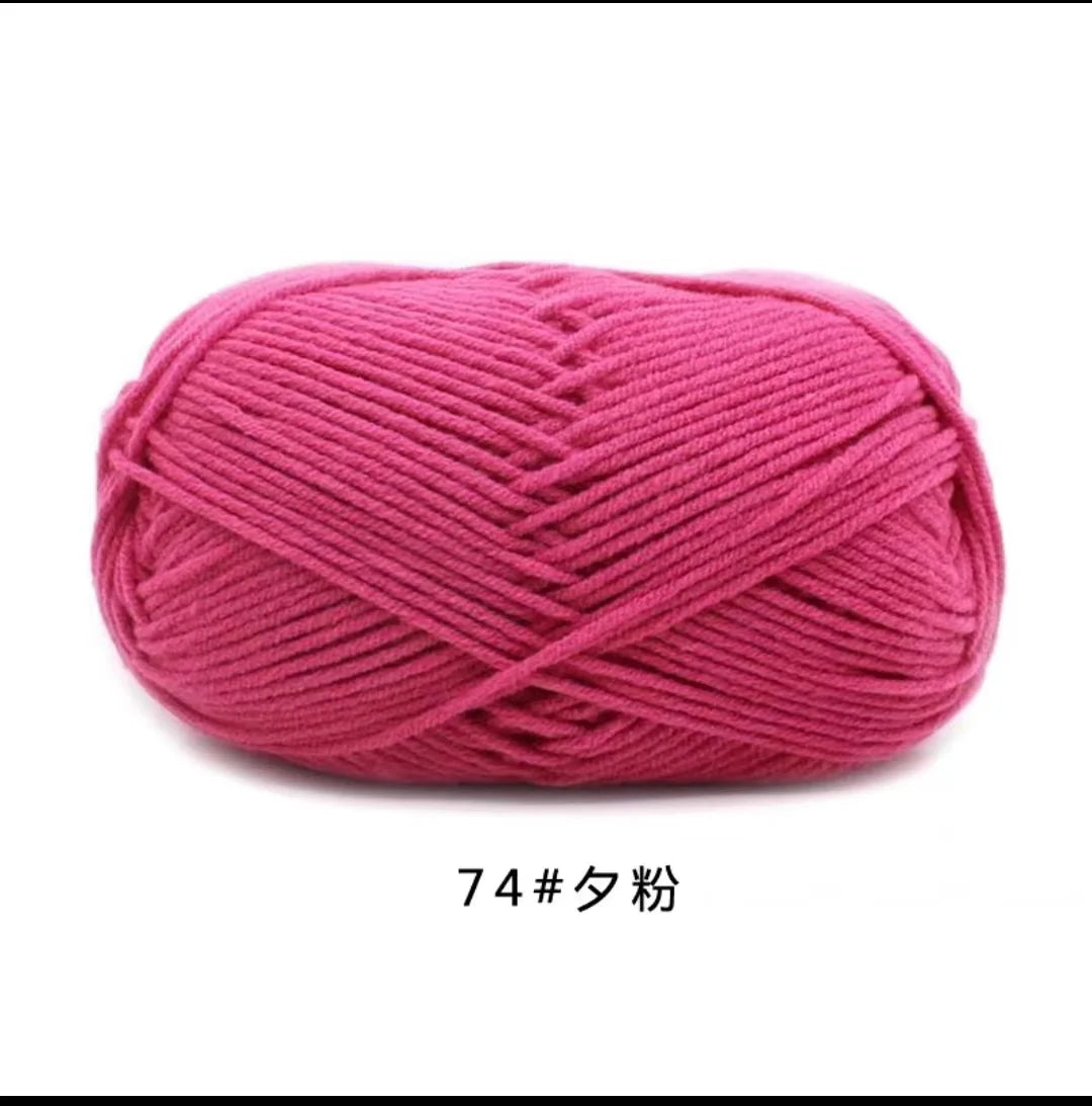A ball of bright pink 4-ply milk cotton yarn for knitting and crochet
