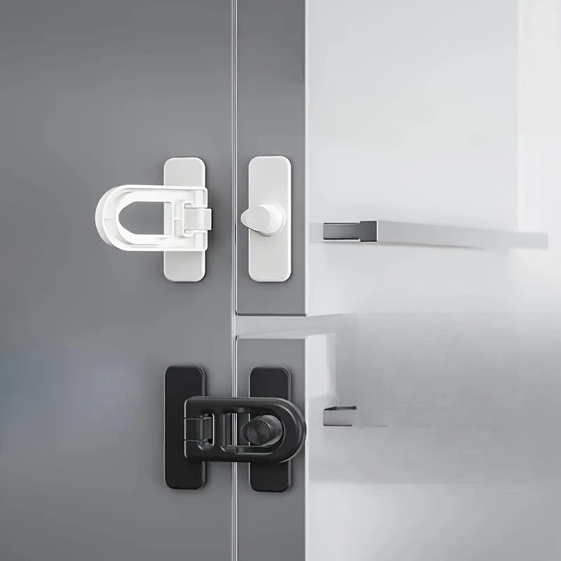 Close-up of modern, non-drill child safety door locks installed on a gray cabinet or appliance door.