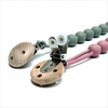 A food-grade silicone pacifier clip with an anti-lost chain, featuring a wooden component and silicone beads.