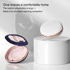 A compact orthodontic retainer case with a built-in mirror is shown open on a white stand.