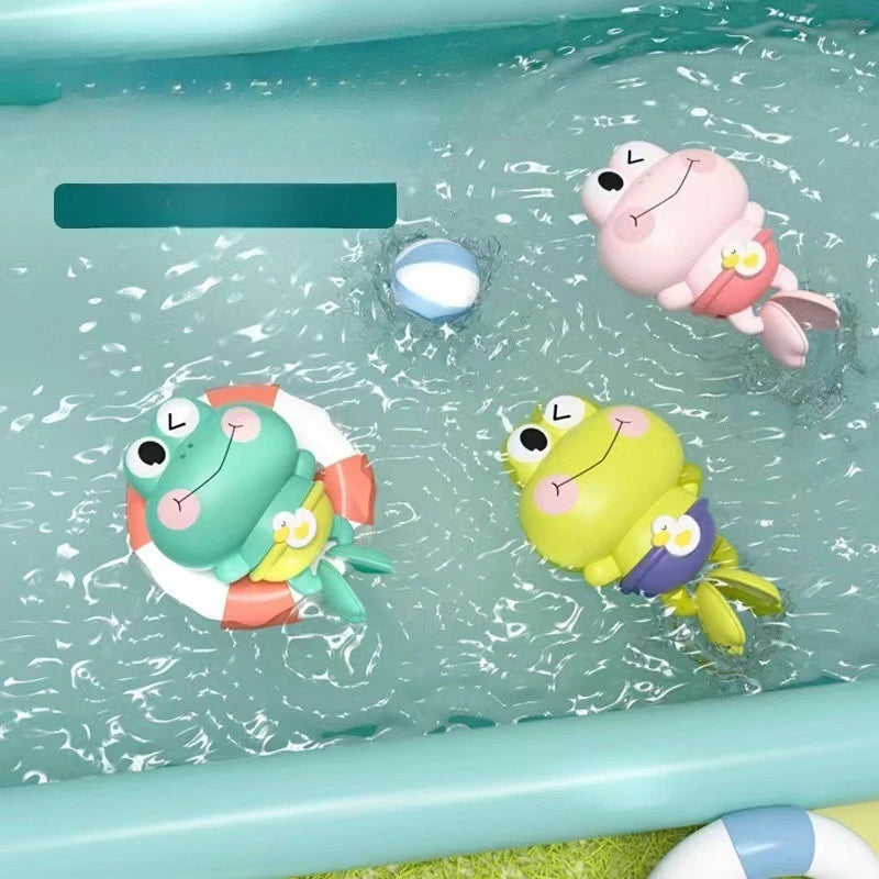A set of wind-up bath toys featuring cartoon turtles, ducks, and whales floating in water.