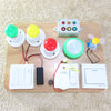 A wooden board featuring various colorful Montessori learning accessories including knobs, buttons, and a light switch.