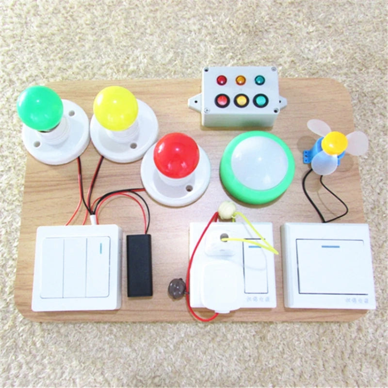 A wooden board featuring various colorful Montessori learning accessories including knobs, buttons, and a light switch.