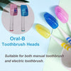 A collection of colorful oral toothbrush heads in various shades including pink, blue, and yellow, shown next to a white cup.