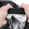 Hands are opening a black heavy-duty outdoor push mower cover to reveal a shiny silver protective layer.
