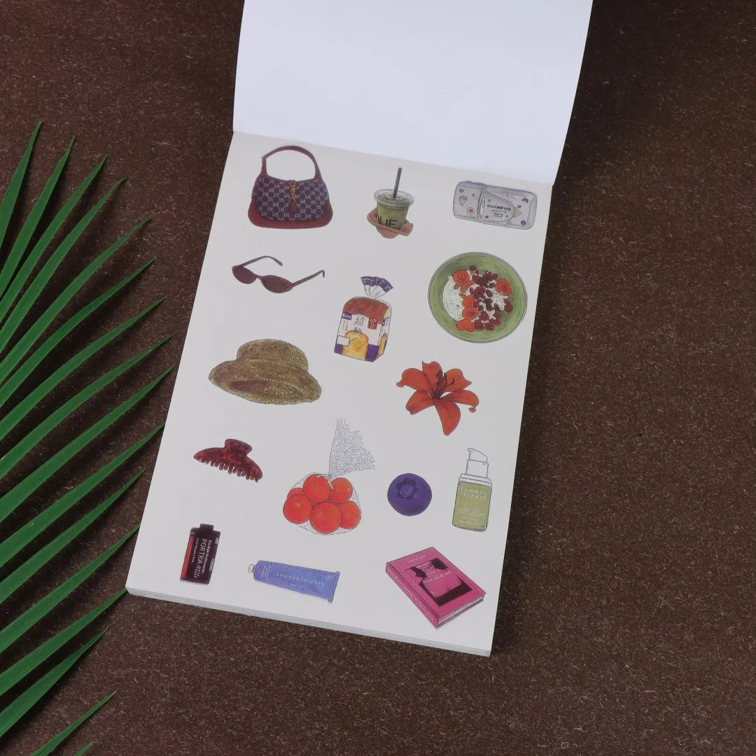 A page from a fruit and letter sticker book featuring various stickers like a handbag, sunglasses, a hat, and fruit designs.