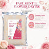 Bag of flower drying silica gel crystals with instructions and surrounding pink roses