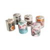 A collection of vintage botanical washi tape rolls featuring floral designs in various muted and vibrant colors.