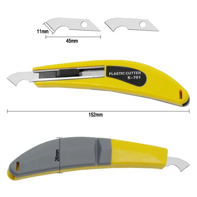 Yellow plastic rotary cutter kit with spare blades, ruler, and cutting mat.