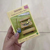 A packaged set of Sylvanian Families Forest Friends featuring wooden furniture and food items.