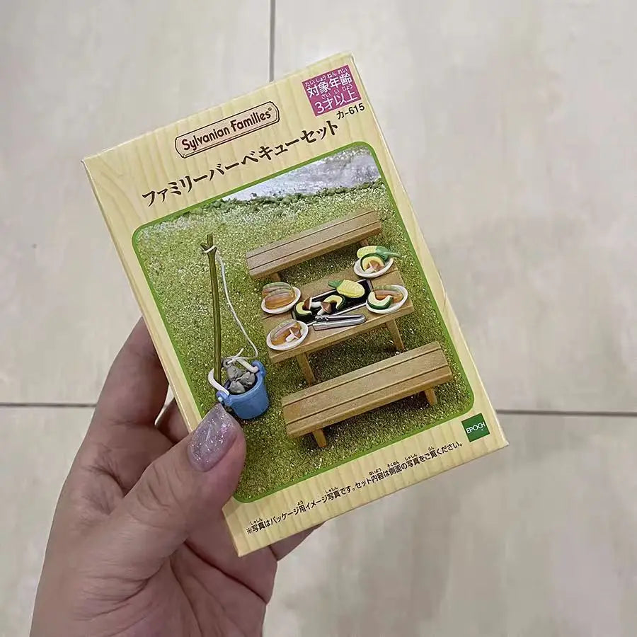 A packaged set of Sylvanian Families Forest Friends featuring wooden furniture and food items.