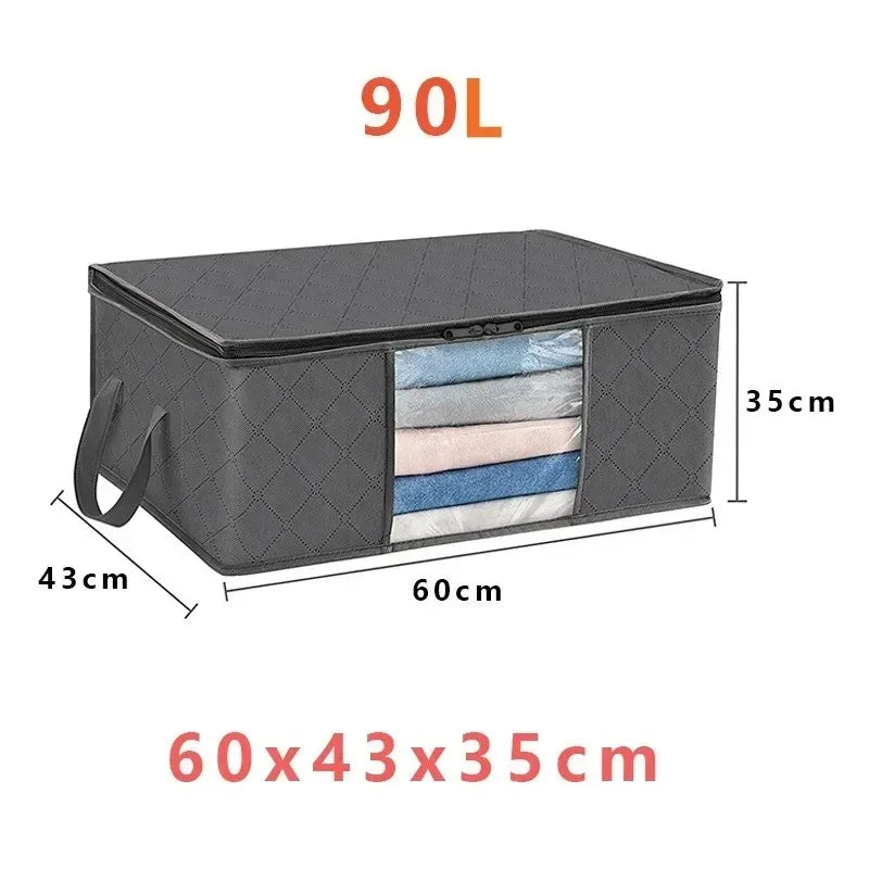A dark gray foldable storage bag with a transparent window showing folded textiles.