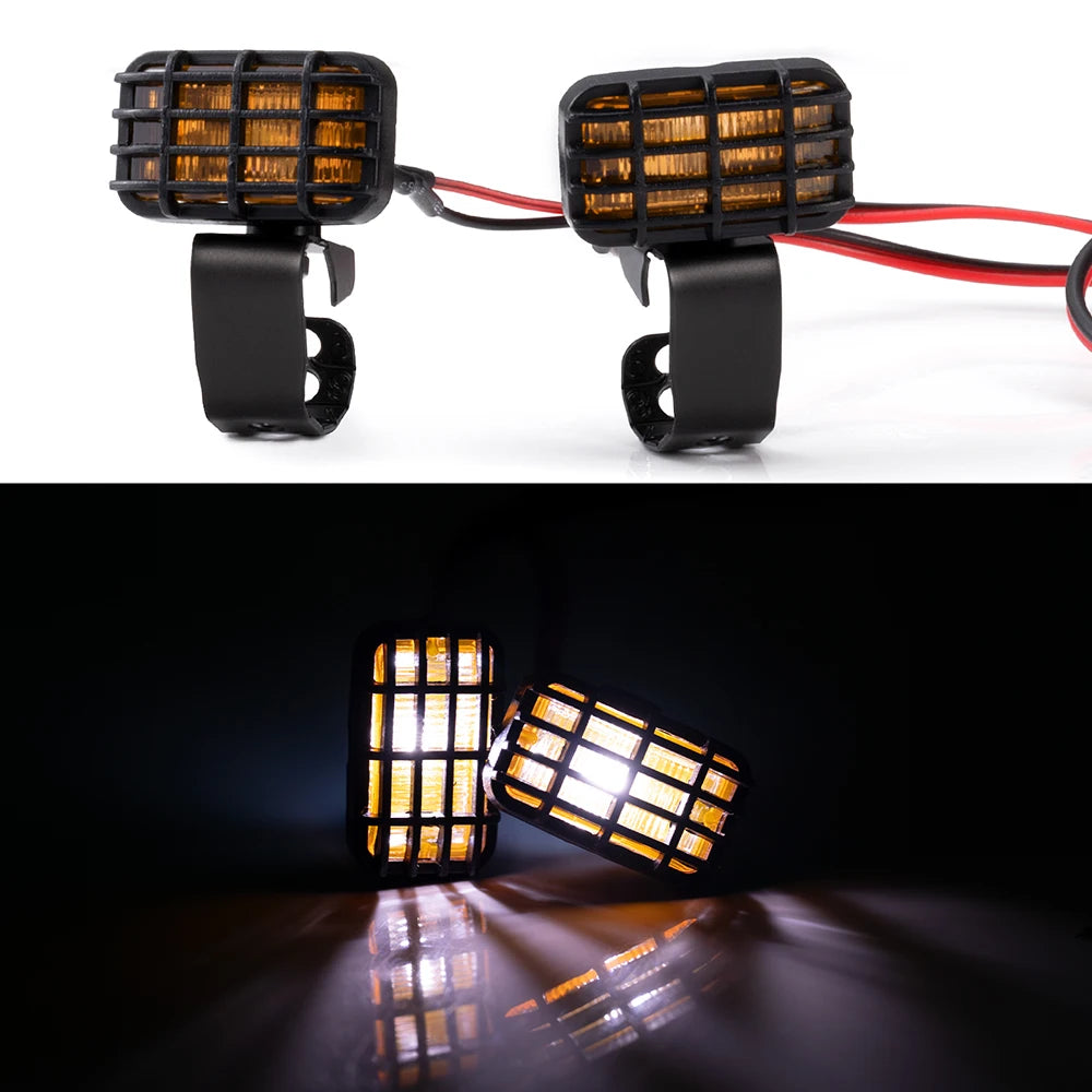 A pair of black LED headlight and spotlight units for RC crawler trucks, shown in both assembled and illuminated views.