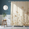 Beige floral waterproof shower curtain featuring a botanical design hanging in a bathroom.