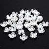 A pile of 100 white acrylic pearl spacer beads for jewelry making