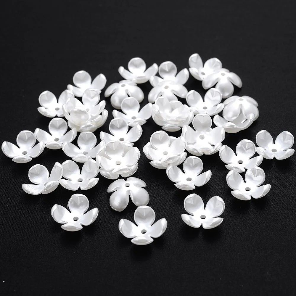 A pile of 100 white acrylic pearl spacer beads for jewelry making