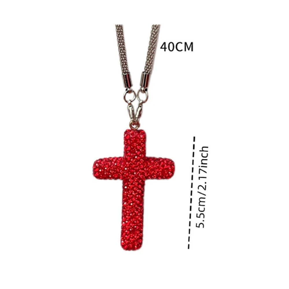 Stainless steel rhinestone cross pendant with a hanging chain and a red cross shape.