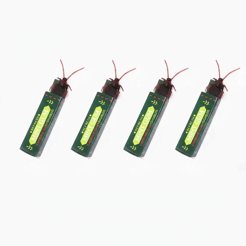 A pack of realistic cockroach prank gum toys with red antennae and green packaging.
