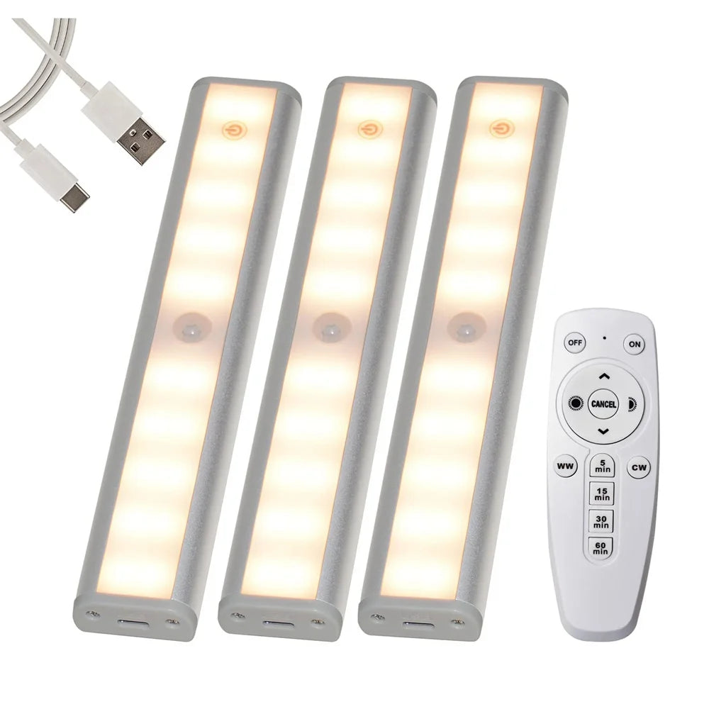 Three rectangular LED under-cabinet lights with a remote control for touch operation