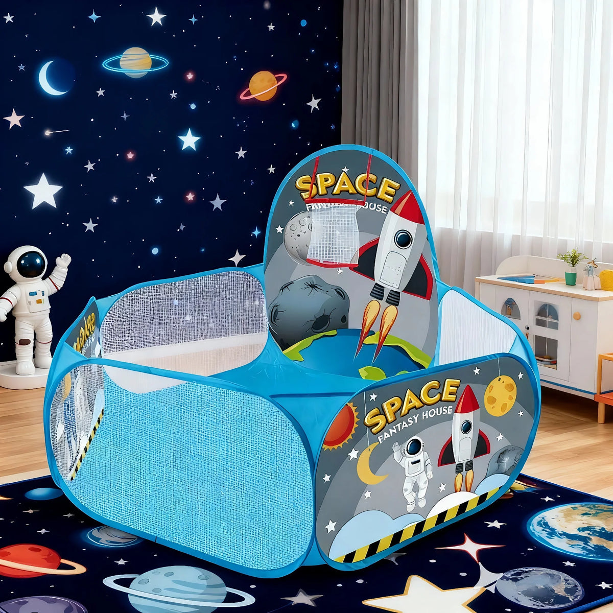 A blue foldable pop-up play tent featuring space themes like stars planets and a rocket for children.