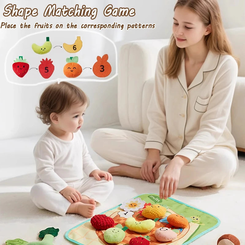 A young girl and toddler are playing a shape-matching game with fruits on a mat, demonstrating fine motor skills.