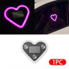 A heart-shaped LED light fixture with a solar panel, shown in various contexts.