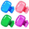 Three colored portable toothbrush head covers with clips in blue, pink, and green.
