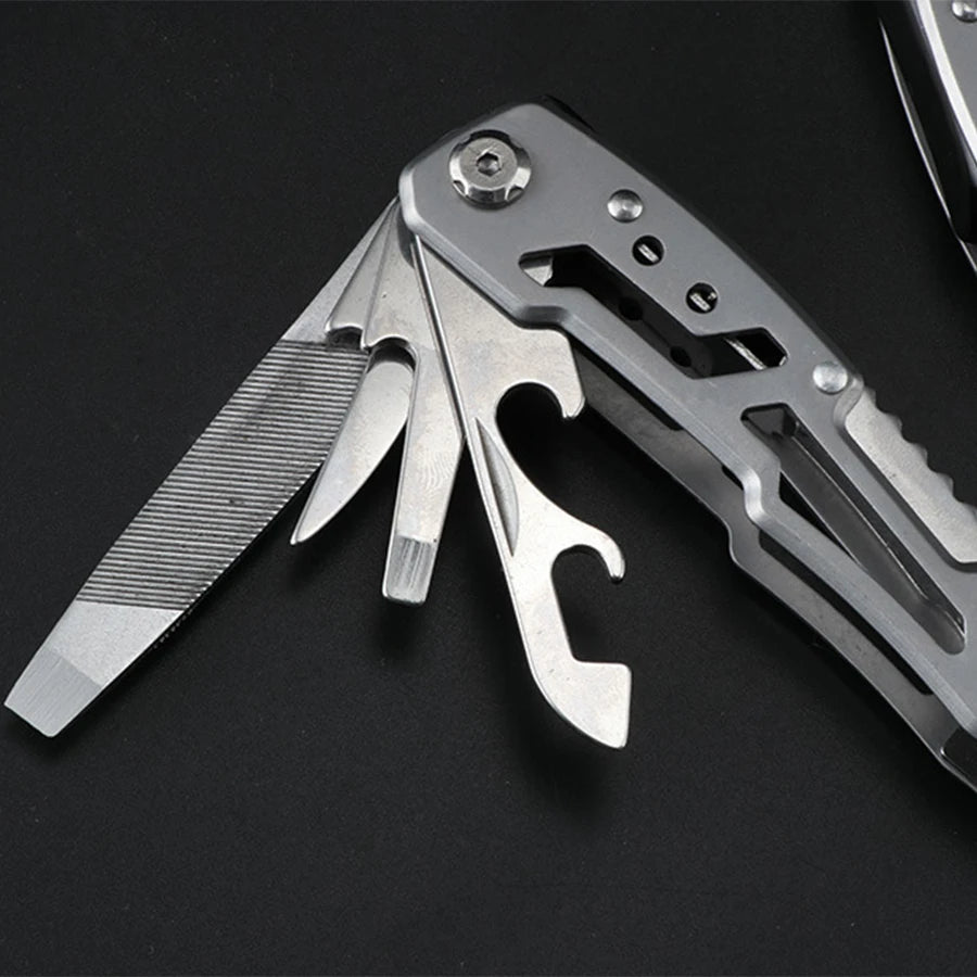A stainless steel pocket multitool showing various tools including pliers and blades.