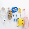 Neodymium magnetic pushpins in various colors including silver, blue, and yellow attached to a white background