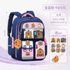 A dark blue school backpack featuring various capybara-themed charms and ergonomic design for children.