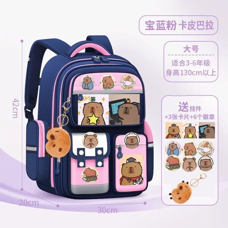 A dark blue school backpack featuring various capybara-themed charms and ergonomic design for children.
