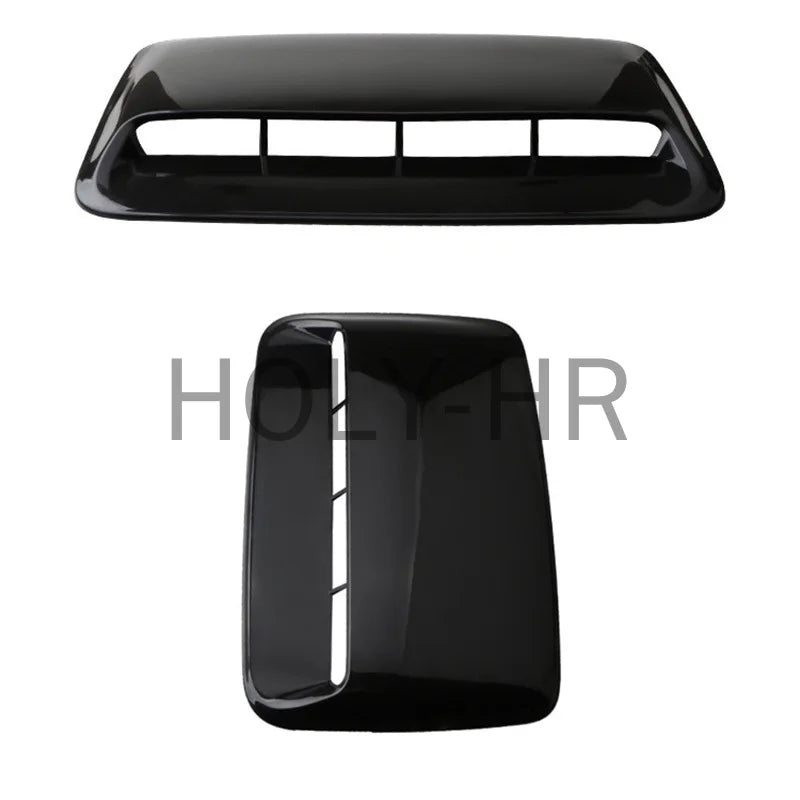 Black decorative hood scoop cover with a rectangular opening for an air intake vent.