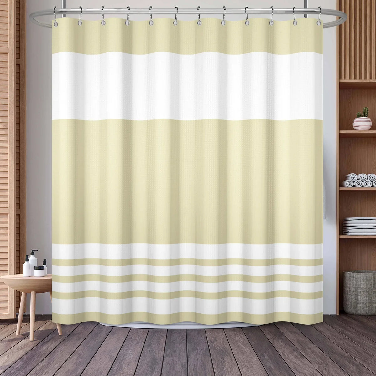A beige and white striped waffle weave shower curtain hanging in a bathroom setting.