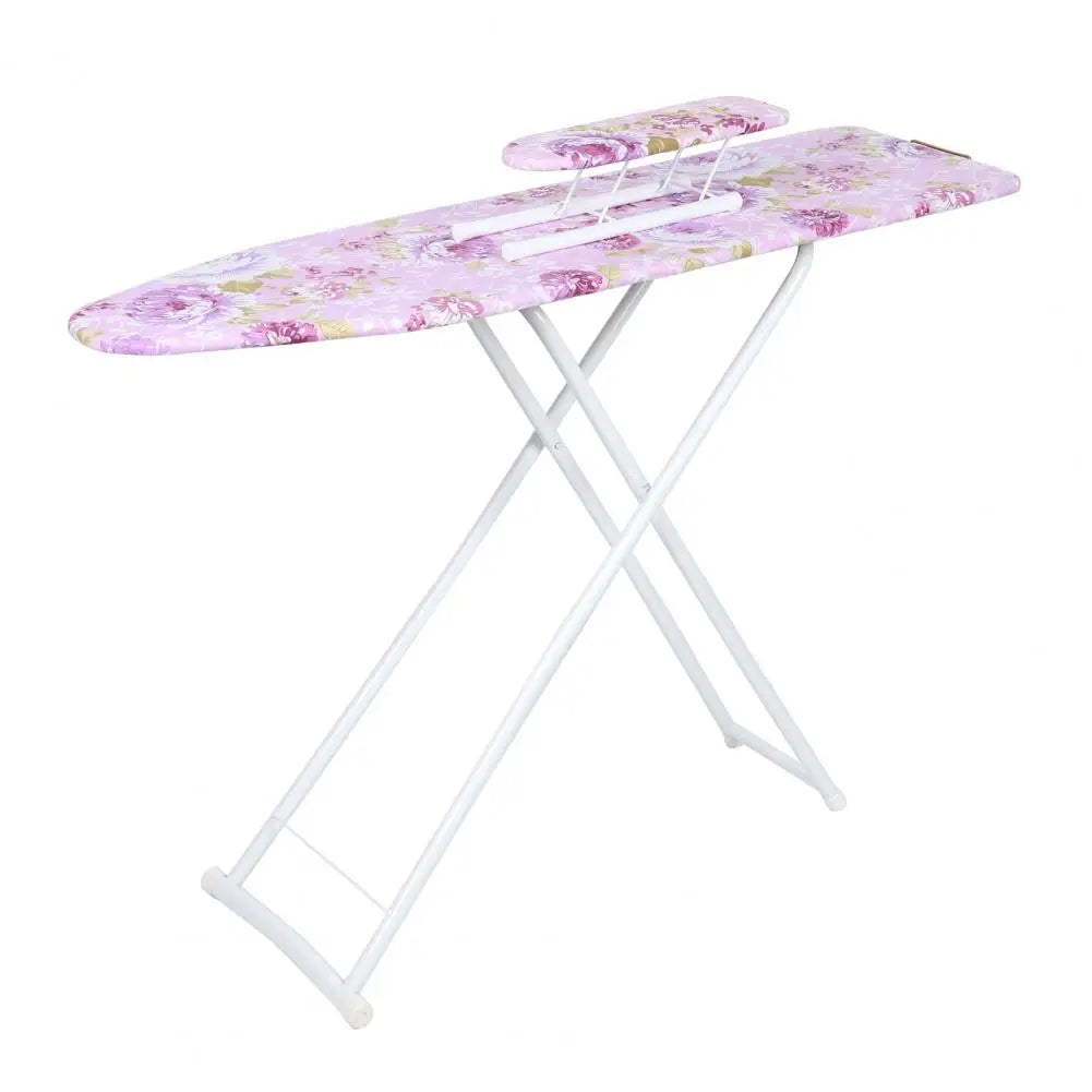 A pink floral ironing board with a white frame and adjustable handles.