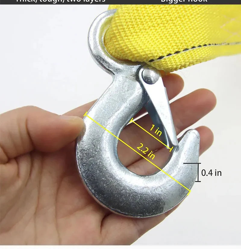 A close-up of a silver heavy-duty tow hook with yellow grip, showing its dimensions.
