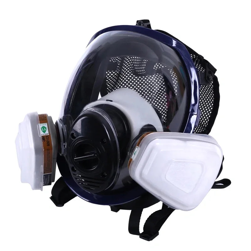 A full face respirator mask with a dark blue frame and clear visor is shown against a white background.