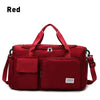 A red waterproof travel duffle bag with a separate shoe compartment.